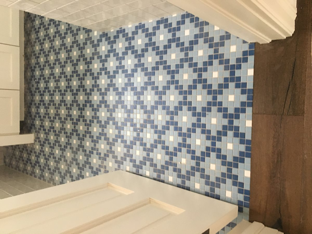 room with mosaic tile flooring