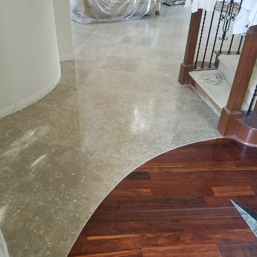 lobby with hardwood and stone flooring
