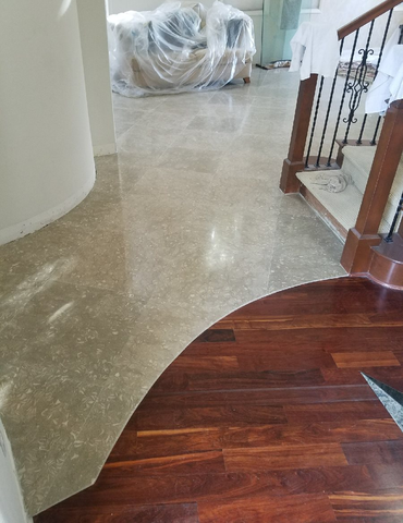 lobby with hardwood and stone flooring