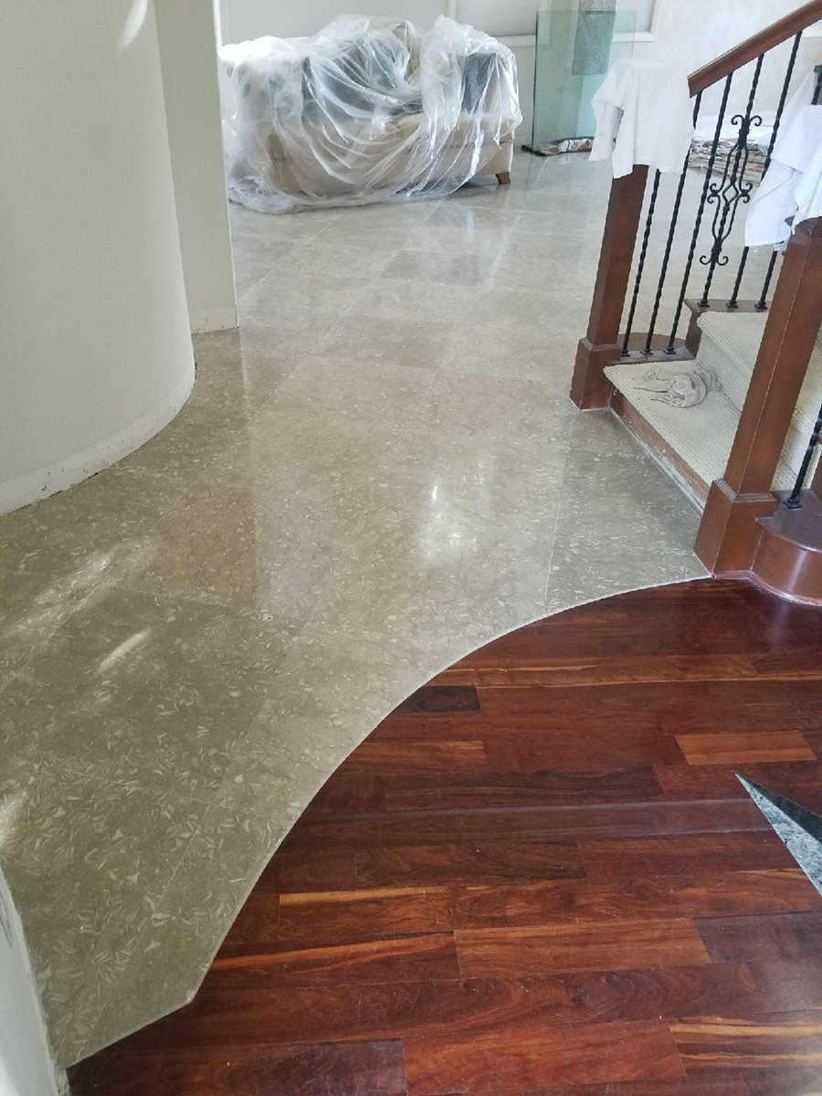 lobby with hardwood and stone flooring