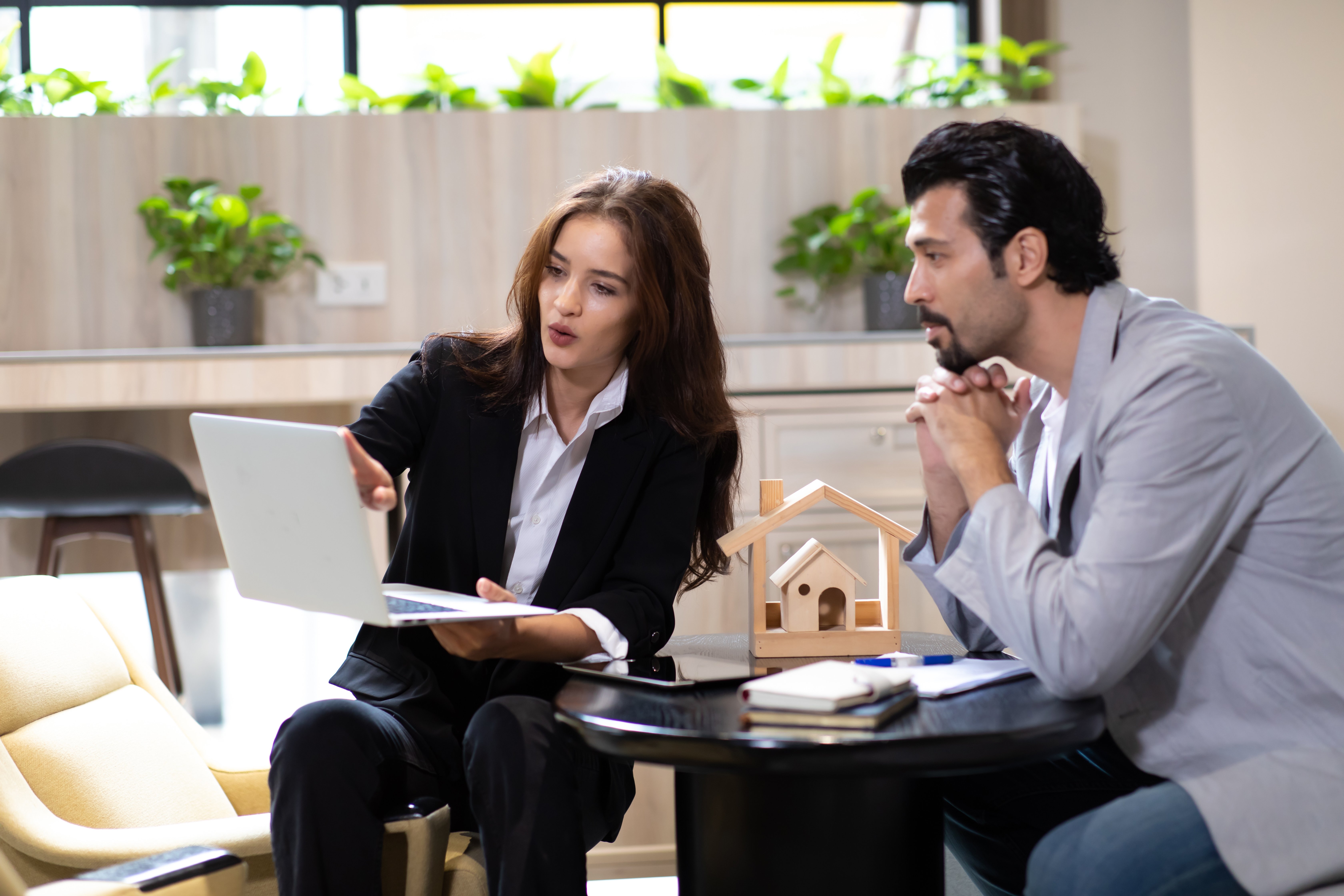 men and women looking at financing paper in San Marcos, CA