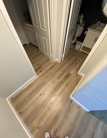 hallway with hardwood flooring