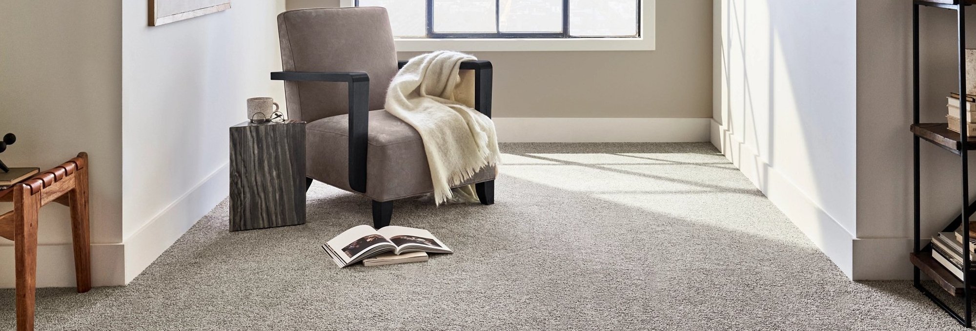 bright room with an armchair on a beige carpet floor from Kenny's Custom Flooring Inc. in San Marcos, CA